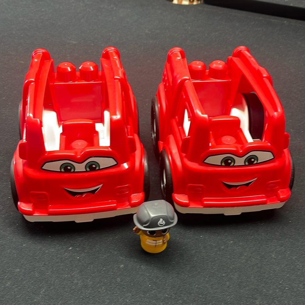 Mega Bloks (2) red fire trucks. One figure